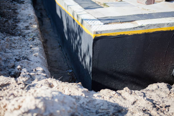 Professional Basement Waterproofing technician working in Newton, WI